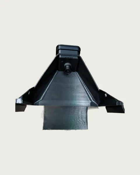 Inside the hood: the USB camera board and its wide lens mounted in the cap