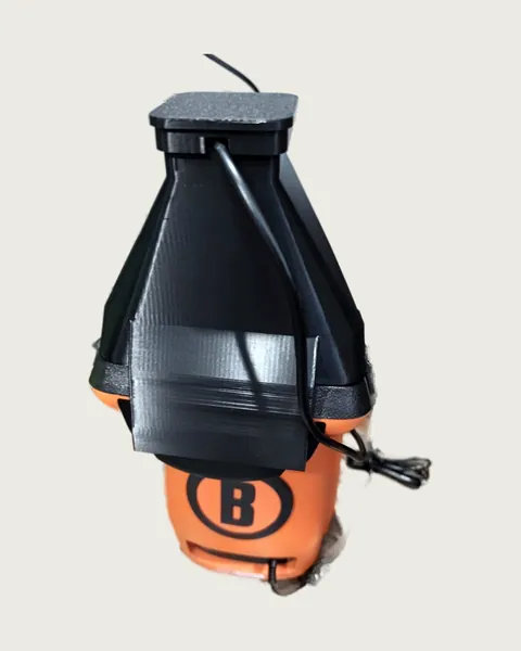 A black 3D-printed camera hood fitted on an orange and black Bushnell Launch Pro, USB cable running down the back